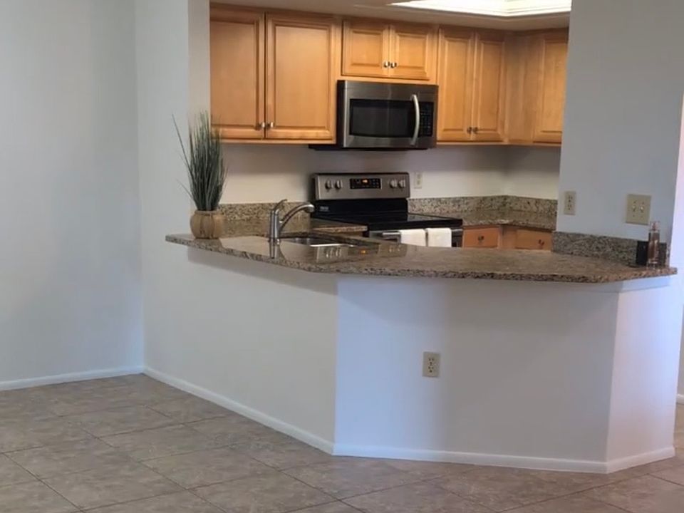 Open kitchen with stainless appliances