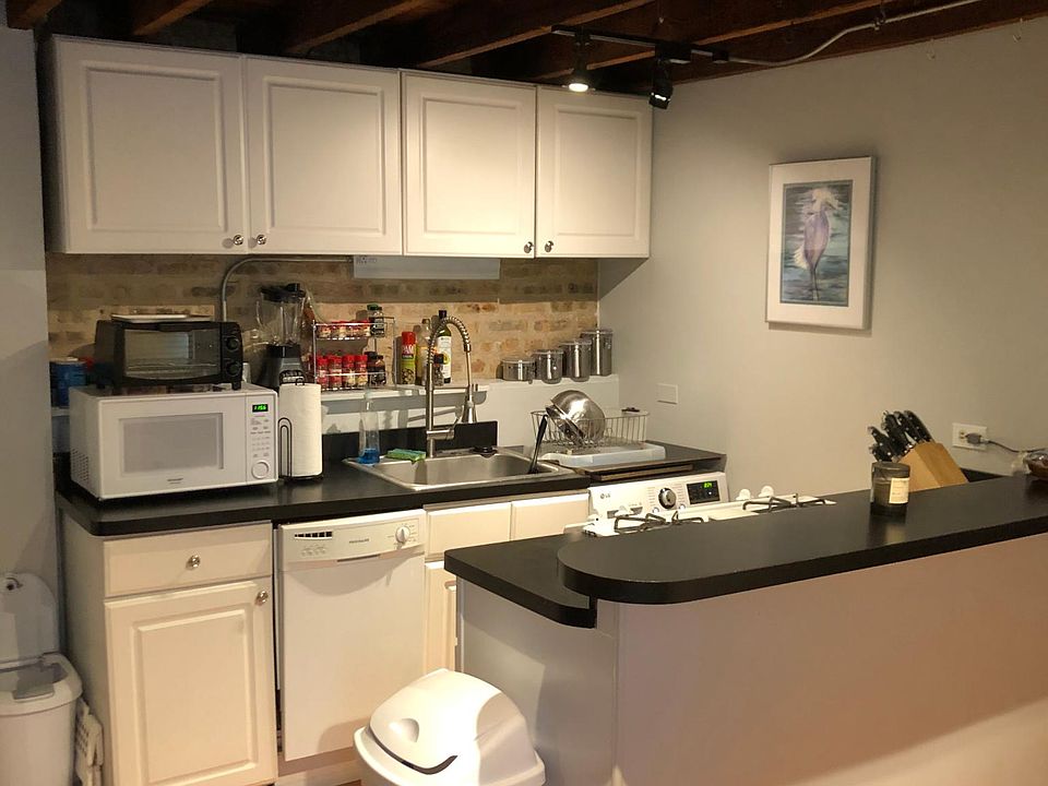 Dishwasher and washer/dryer combo unit (right corner) saves on space, water and electricity