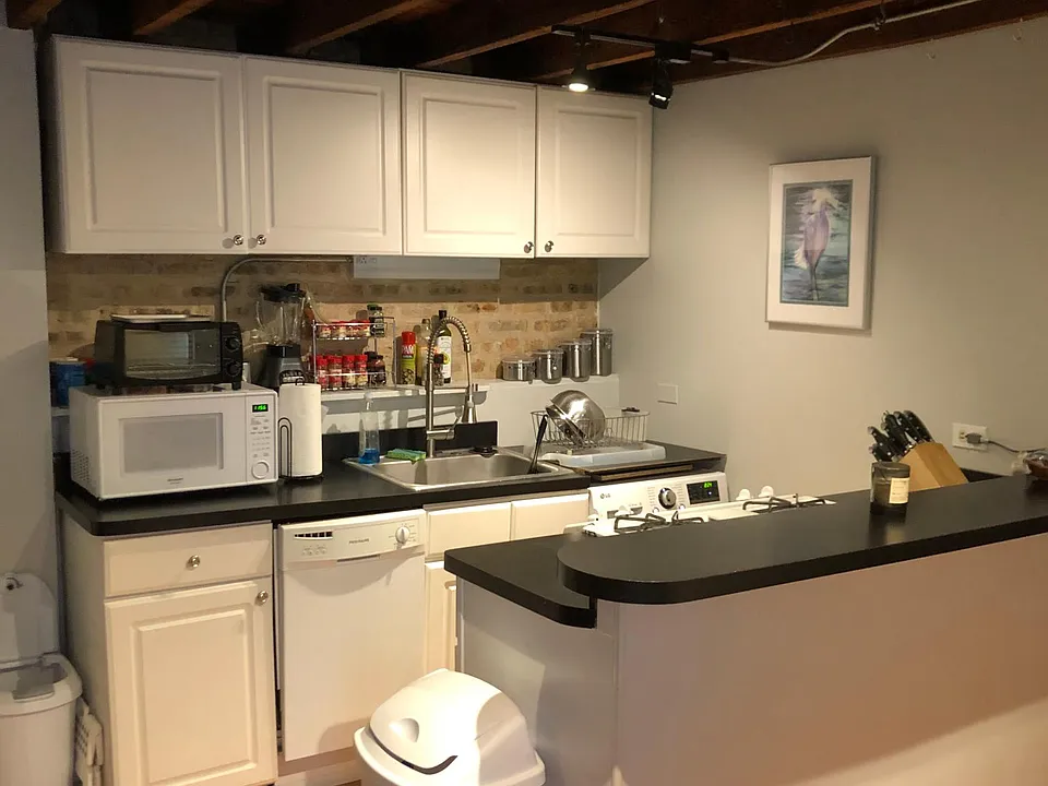 Dishwasher and washer/dryer combo unit (right corner) saves on space, water and electricity