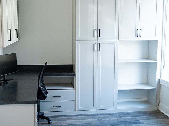 Full office on ground floor with ample cabinet space for ease of remote work.