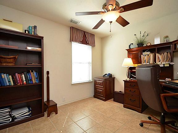 Off of the formal dining is a cozy study/library area.