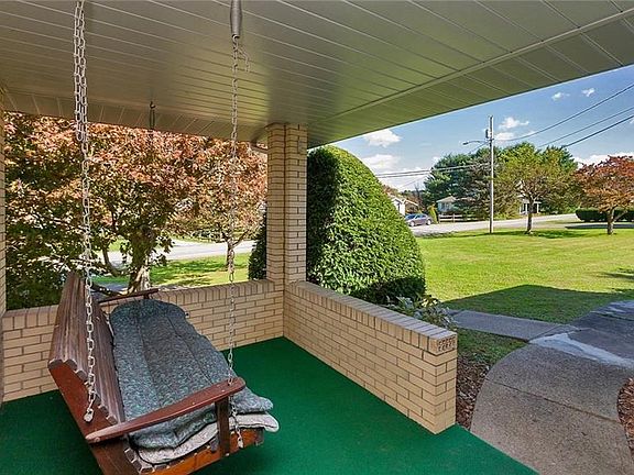 Just imagine the coffee you can enjoy on the swing on this covered front porch