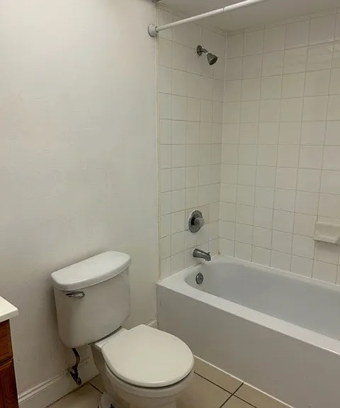 bathroom with tub and shower