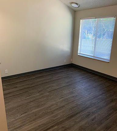 New flooring in the open living room in this beautiful apartment