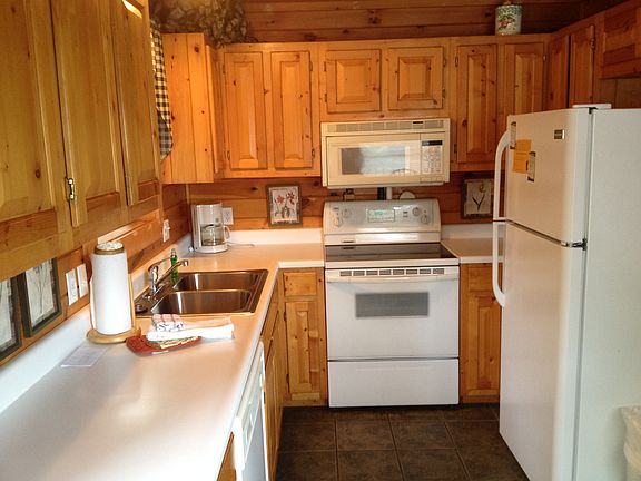 Kitchen but since picture made the ref has been moved to right of range giving more kitchen floor space.