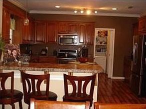 Kitchen area is spacious and has a center work space.