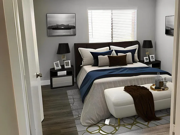 Large bedroom with double doors open to living space.