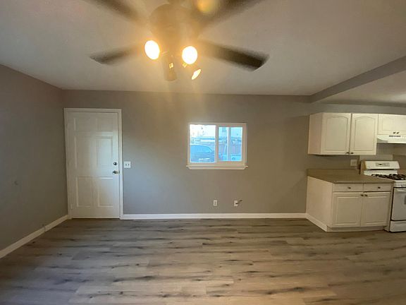 Front entrance and dining area, with kitchen to the right.