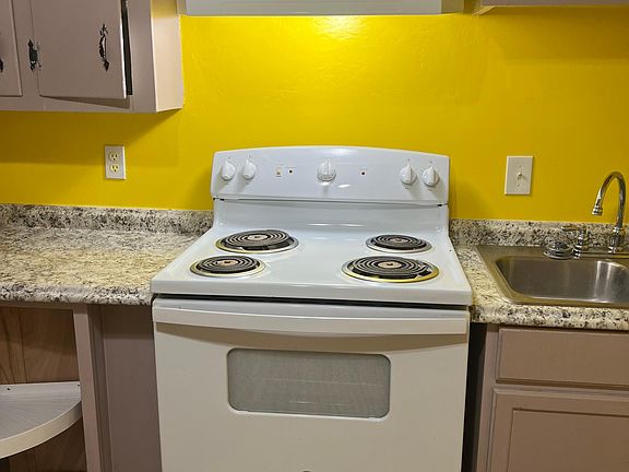 kitchen with stove and sink area