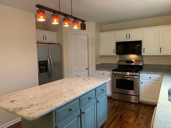 Kitchen, Side x Side Refrigerator, Gas Stove, Microwave and Dishwasher, all Stainless Steel