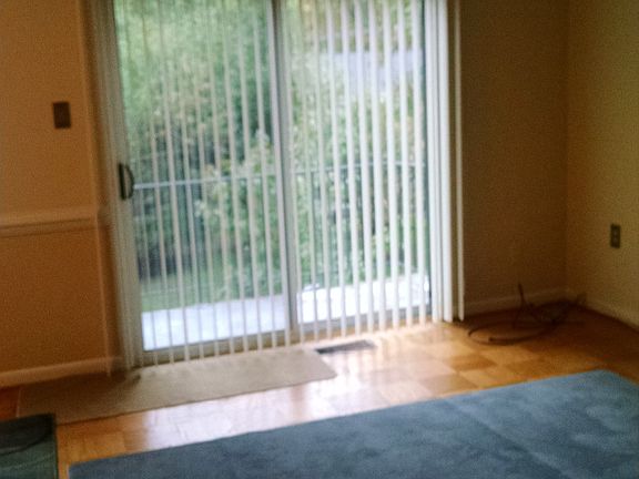 sliding glass door exits to a large balcony