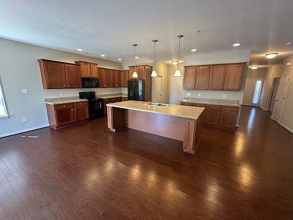 Kitchen open to living room with island