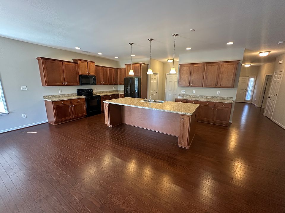 Kitchen open to living room with island