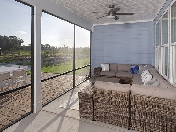 Screened porch with plenty of space for outdoor furniture.