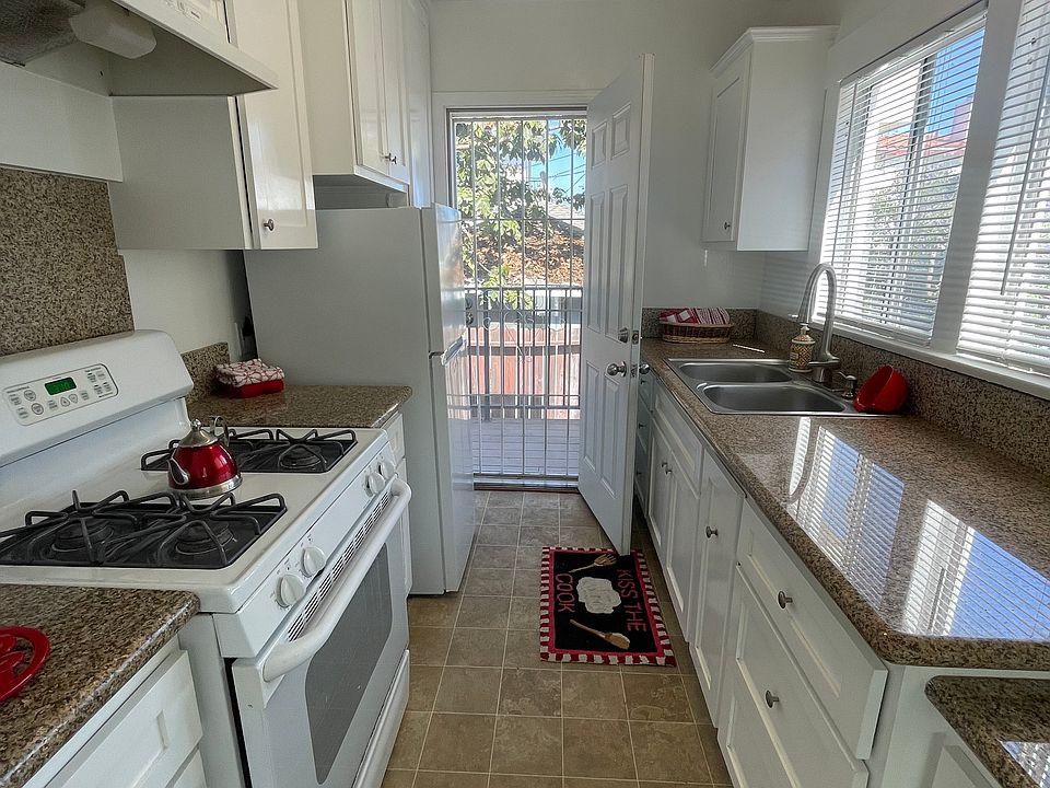 Backdoor with screen leads to small patio