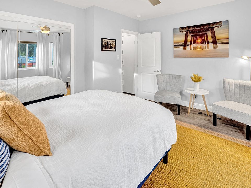 Bedroom 1 with Queen size bed and sitting area.