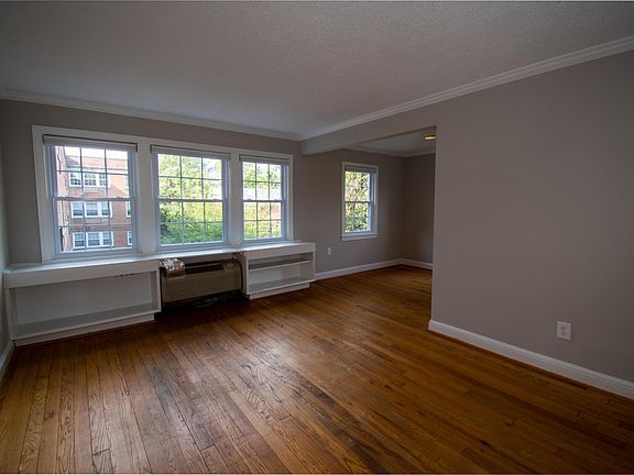 Large living room with amazing light and built in storage. New windows and blinds throughout the apartment.