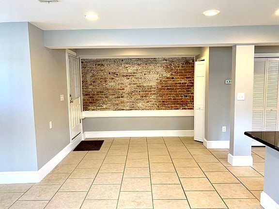 Exposed brick with additional space for home office.