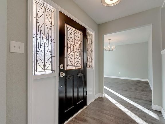 Front entry. Beautiful and welcoming front door, original to the house, but beautifully refinished, with added new hardware.