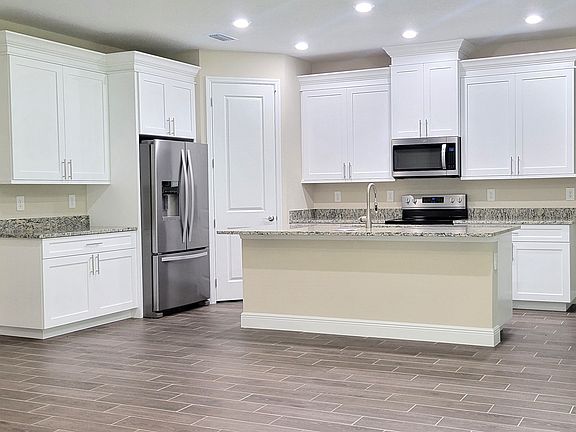 kitchen with large corner pantry