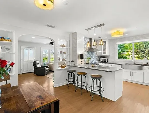 Kitchen showing breakfast bar and dining area (archival photo)
