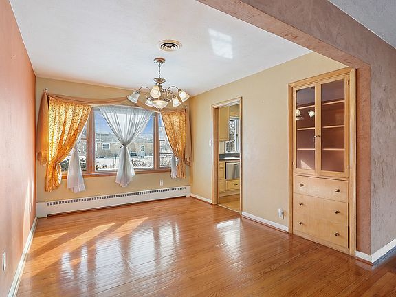 Open to the Living room, yet separated by a ceiling beam, the dining room is casual enough for every