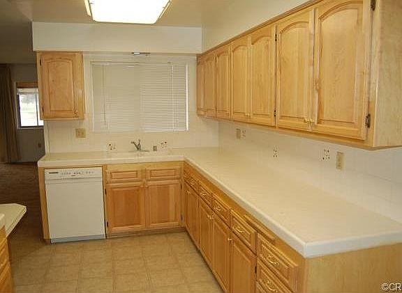 Refaced kitchen cabinets with tile counters