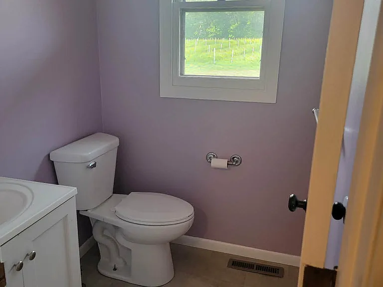 Half bath right off garage entry.