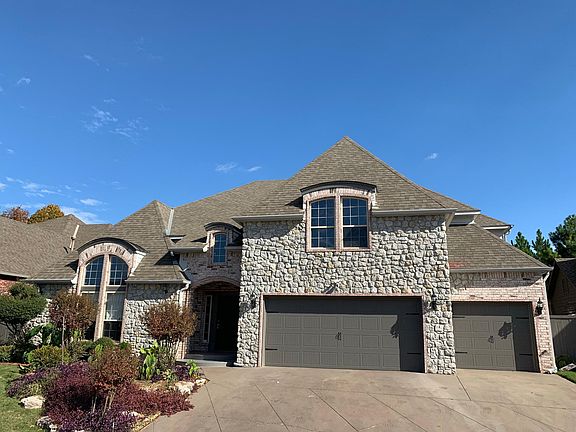Freshly painted front of house. New garage doors