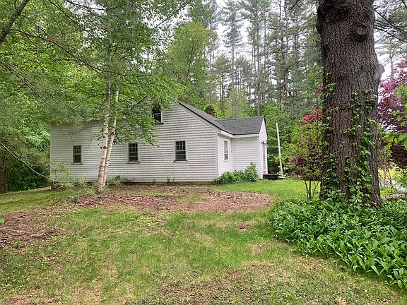 Photo shows depth of mudroom. 1st window from the front of the house corner to the back of the house is a living room window, second window is the smaller bedroom, and third window is to the bigger bedroom. Attic window.