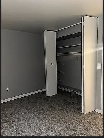 Enjoy ample storage with this bedroom's expansive closet, perfect for organizing your essentials.