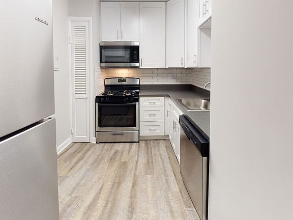 Modern shaker style cabinetry with chrome pulls