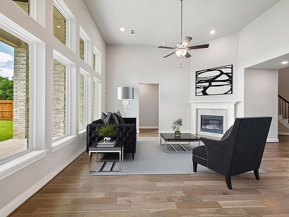 Gorgeous flooring and natural light in great room, virtually staged for demonstration