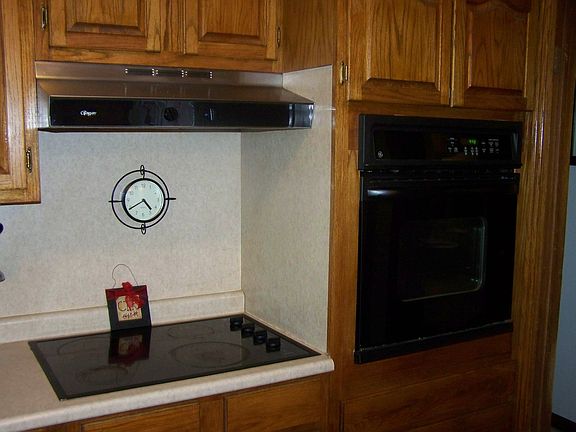 Flat surface stove top and built-in oven