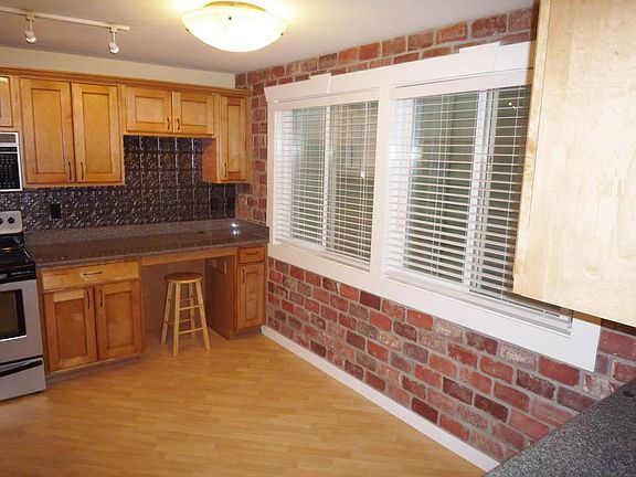 Built-in Hutch, Brick Accent Wall in Dining Area