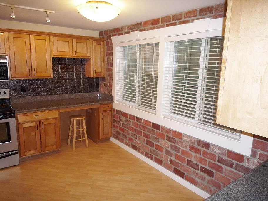 Built-in Hutch, Brick Accent Wall in Dining Area