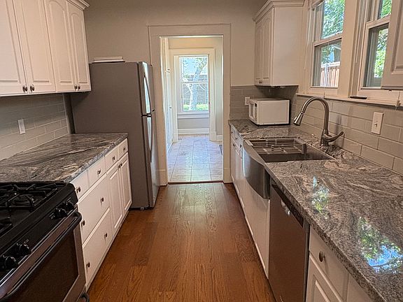 galley kitchen: gas range, dishwasher, refrigerator