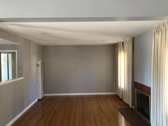 Living room with gas fireplace and hardwood floors