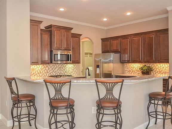Amazing gourmet kitchen with this fabulous wrap-around breakfast bar.