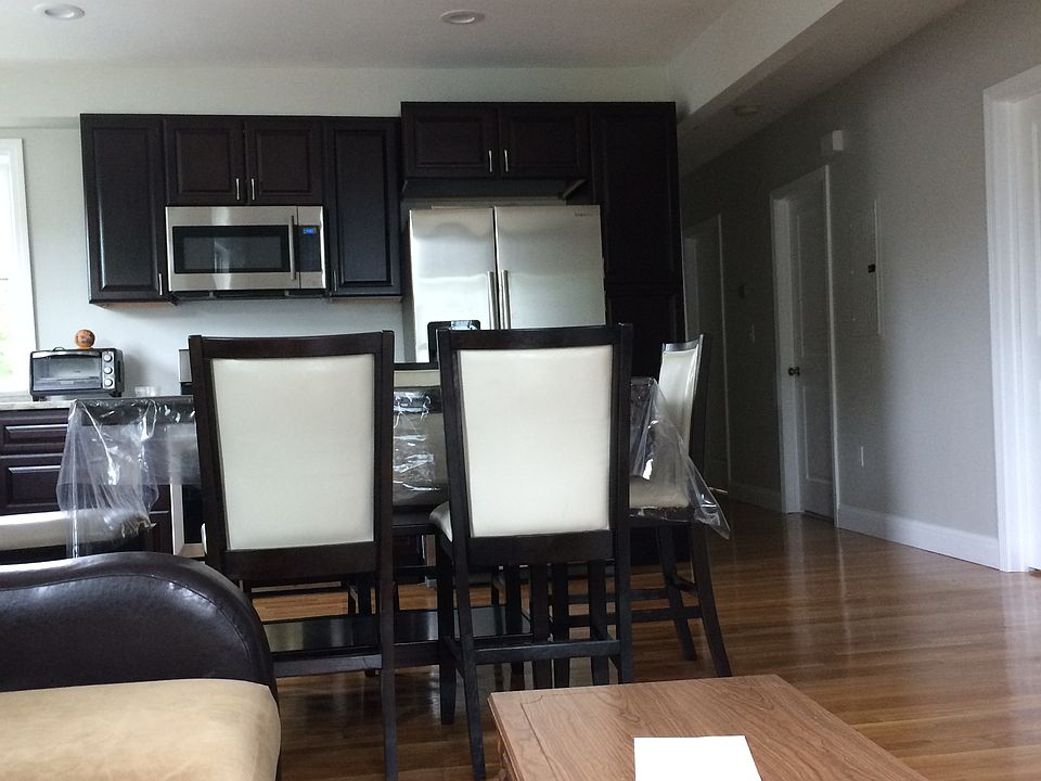 Large open living and dining area with natural light