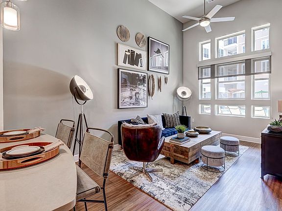spacious living room with high ceilings and large windows