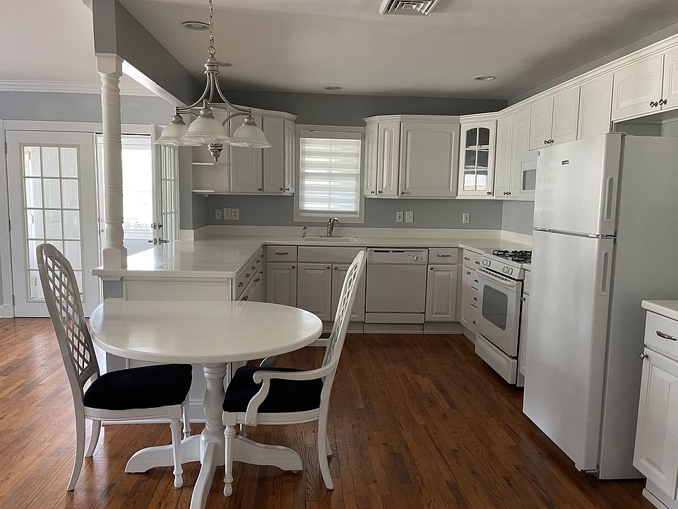 Kitchen/Hardwood floors throughout house.