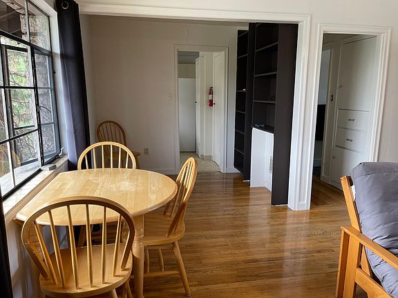 furnished dining area and more shelves