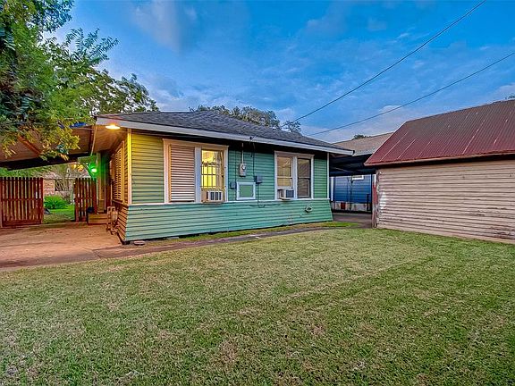 Large backyard with covered patio, perfect for entertaining.