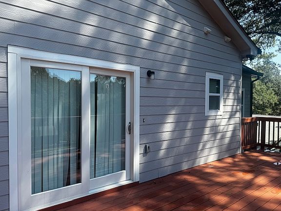 Unit B upper level sliding door entrance and private deck