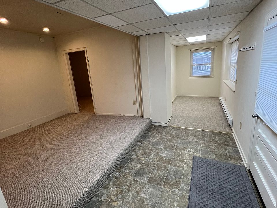 View from kitchen overlooking family room and flex space off entry