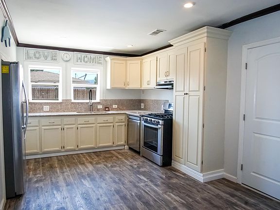 Kitchen comes with stainless steal dishwasher and range.