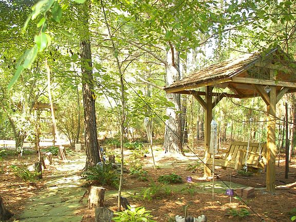 Rear wooded path and gardens