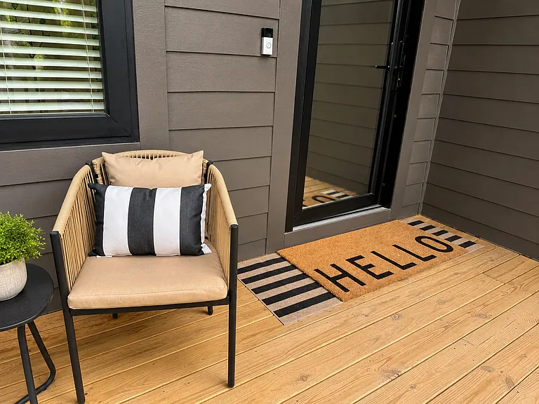 The Edgewood Suite is spacious primary king room with smart TV, blackout curtains, bedside charging, private work station, designer decor, 2 closets & plush bedding offering a self-contained escape & elevated night's sleep.