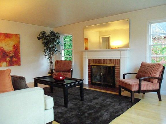 Sunny and Bright living room with fireplace.